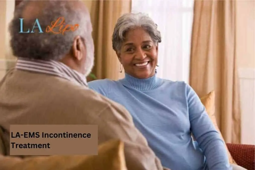 Couple sat smiling at each other - LA-EMS treatment St Ives