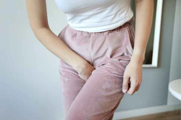 older woman running to the toilet because of urinary incontinence St Ives