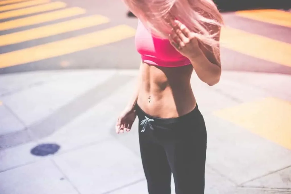 Woman with toned stomach after LA-EMS Body Sculpting Treatment St Ives